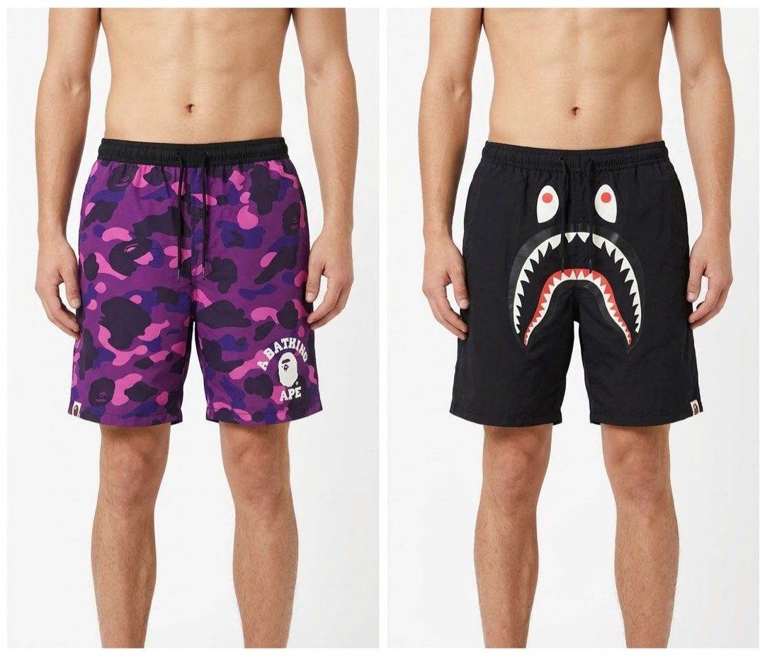 A Bathing Ape BAPE Reversible Shark Camo Shorts (Category: Shorts) located in Manila. Submitted by trueeagle-0a08 (Listing ID 1471189855, Image 1). Description: Bàpé purple camo reversible short ! 30 - 34 waist x 19 length Size medium | 10 color rate flawless | need wash only Authentic | OG - Brand: BAPE - Style: Reversible shorts - Design A: Purple camo - Design B: Black shark face graphic - Details: Adjustable drawstring waistband with branded 