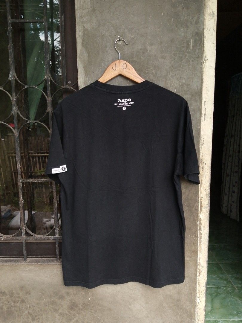 Aape By A Bathing Ape Black Camo Tee (Category: Tshirts & Polo Shirts ) located in Kabankalan. Submitted by evolasdf (Listing ID 1471157185, Image 2). Description: AAPE BY A BATHING APE® Camo Moonface Size: XXL on tag best fit medium to large Dimes: 20x28 - Excellent Condition - Issue cut washtag / Color Rate 9.5/10 📩 LOCATION 📍: Brgy Oringao Kabankalan City.