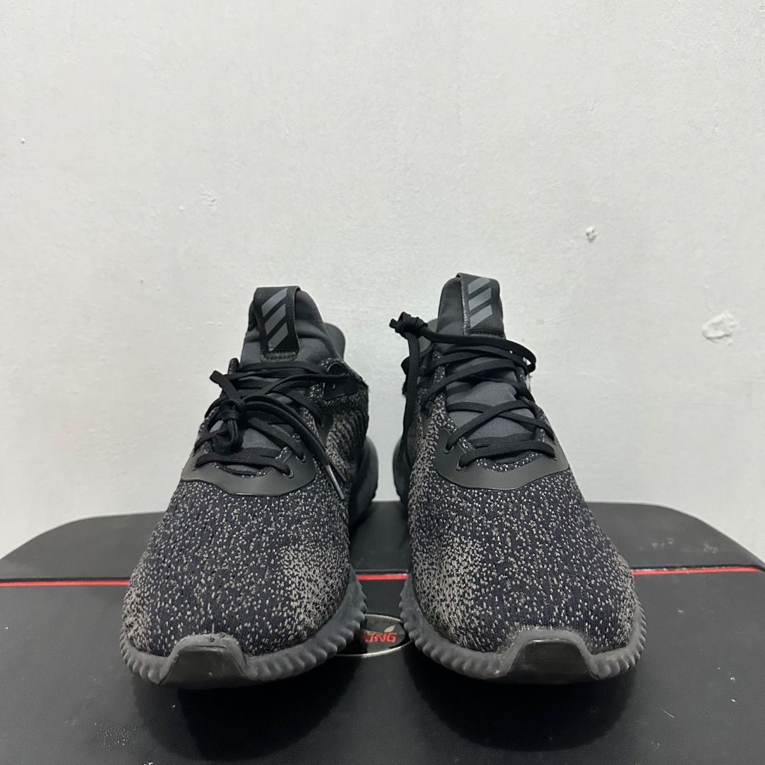 Adidas Alphabounce Black Grey Running Shoes (Category: Sneakers) located in Manila. Submitted by johnpm (Listing ID 1471239828, Image 2). Description: - Brand/Model: Adidas Alphabounce - Color: Black and Dark Grey - Material: Comfortable knit upper with ribbed EVA midsole - Features: Lace-up closure with pull tabs at the tongue and heel - Condition: Minimal signs of wear on soles and uppers, solid grip and supportive cushioning - Best For: Daily 
