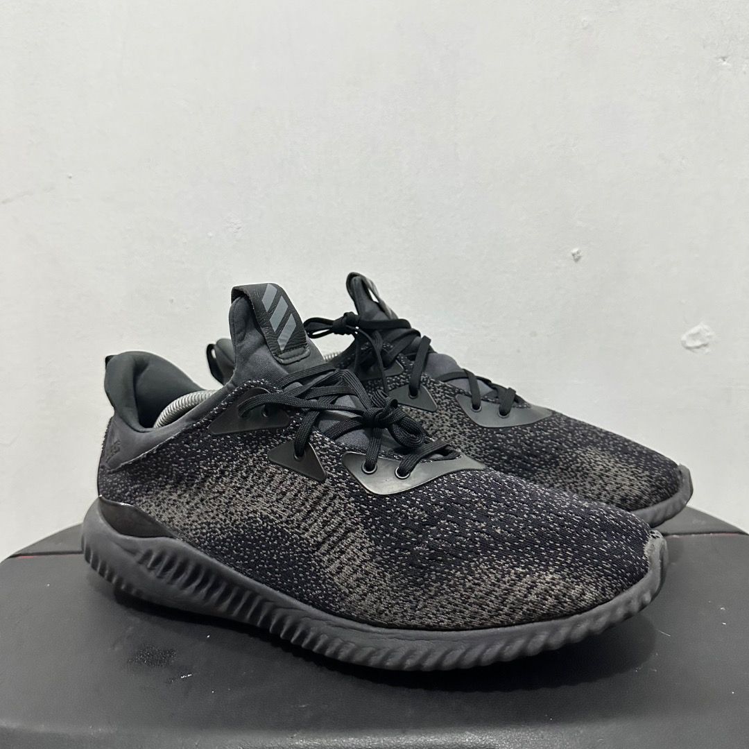 Adidas Alphabounce Black Grey Running Shoes (Category: Sneakers) located in Manila. Submitted by johnpm (Listing ID 1471239828, Image 1). Description: - Brand/Model: Adidas Alphabounce - Color: Black and Dark Grey - Material: Comfortable knit upper with ribbed EVA midsole - Features: Lace-up closure with pull tabs at the tongue and heel - Condition: Minimal signs of wear on soles and uppers, solid grip and supportive cushioning - Best For: Daily 