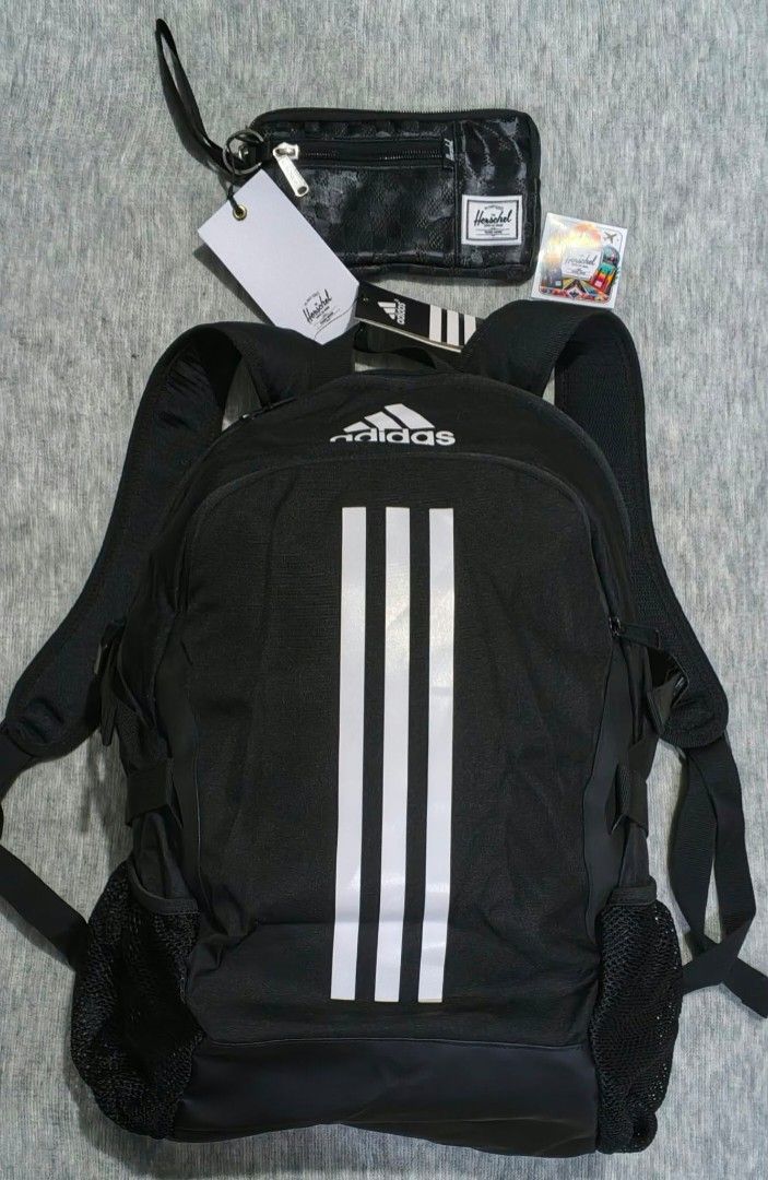Adidas Backpack and Herschel Gadget/CP Pouch Set (Category: Backpacks) located in Quezon City. Submitted by thirdeedimesiv (Listing ID 1471225654, Image 1). Description: -Pamigay Sale!!! - Adidas black power 5 backpack with white stripes, mesh side pockets, and adjustable straps, fits upto 14" laptop. -has dedicated laptop compartment - Includes multiple brand-new Herschel pouches with original tags attached - Pouch colors and designs include nav
