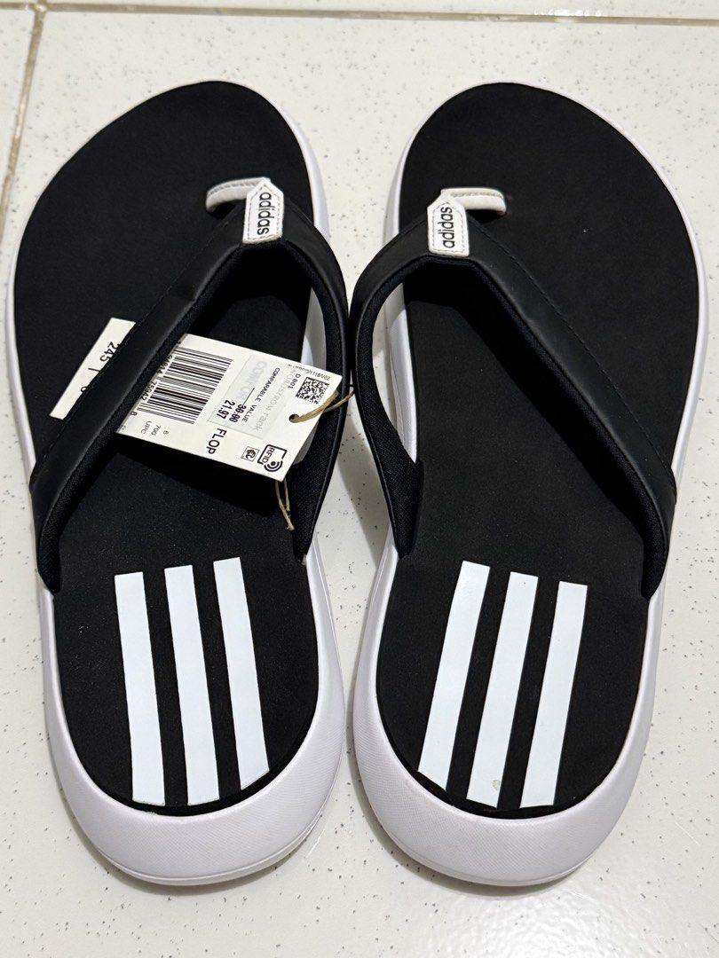 Adidas Comfort Flip-Flops Black White Size 7 (Category: Slippers and slides) located in Binan City. Submitted by just4stuffs (Listing ID 1471257609, Image 3). Description: - Brand: Adidas - Style: Thong flip-flops with classic three-stripe design - Color: Black and white with white strap branding - Size: 7 US - Condition: Brand new with tag.