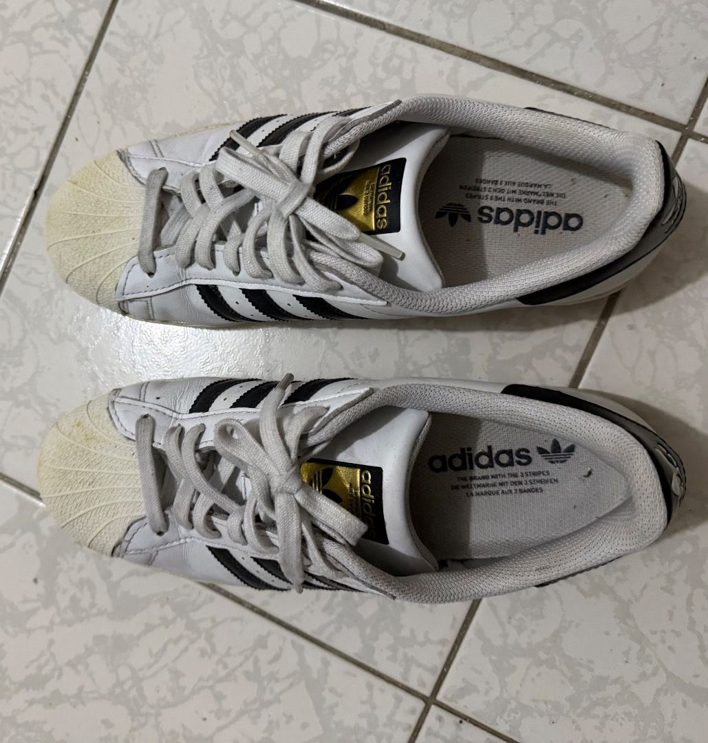 Adidas Superstar White Black Sneakers (Category: Sneakers) located in Manila. Submitted by ytoci (Listing ID 1471253052, Image 3). Description: - Brand: Adidas - Model: Superstar - good condiition but there are signs of yellowing.