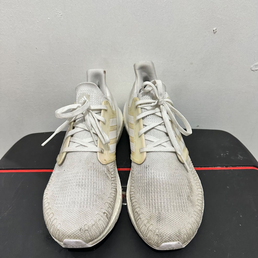 Adidas Ultraboost 20 White Size US 12 (Category: Sneakers) located in Manila. Submitted by johnpm (Listing ID 1471241768, Image 3). Description: - Brand/Model: Adidas Ultraboost 20 - Color: White - Size: US 12 (UK 11.5) - Material & Tech: Knit upper with responsive Boost midsole cushioning - Closure: Lace-up - Condition: Pre-owned with visible dirt and wear on the fabric and soles.
