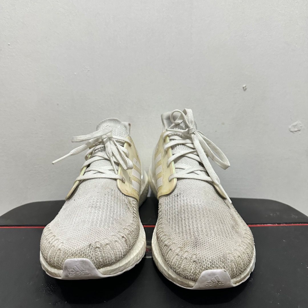 Adidas Ultraboost 20 White Size US 12 (Category: Sneakers) located in Manila. Submitted by johnpm (Listing ID 1471241768, Image 2). Description: - Brand/Model: Adidas Ultraboost 20 - Color: White - Size: US 12 (UK 11.5) - Material & Tech: Knit upper with responsive Boost midsole cushioning - Closure: Lace-up - Condition: Pre-owned with visible dirt and wear on the fabric and soles.