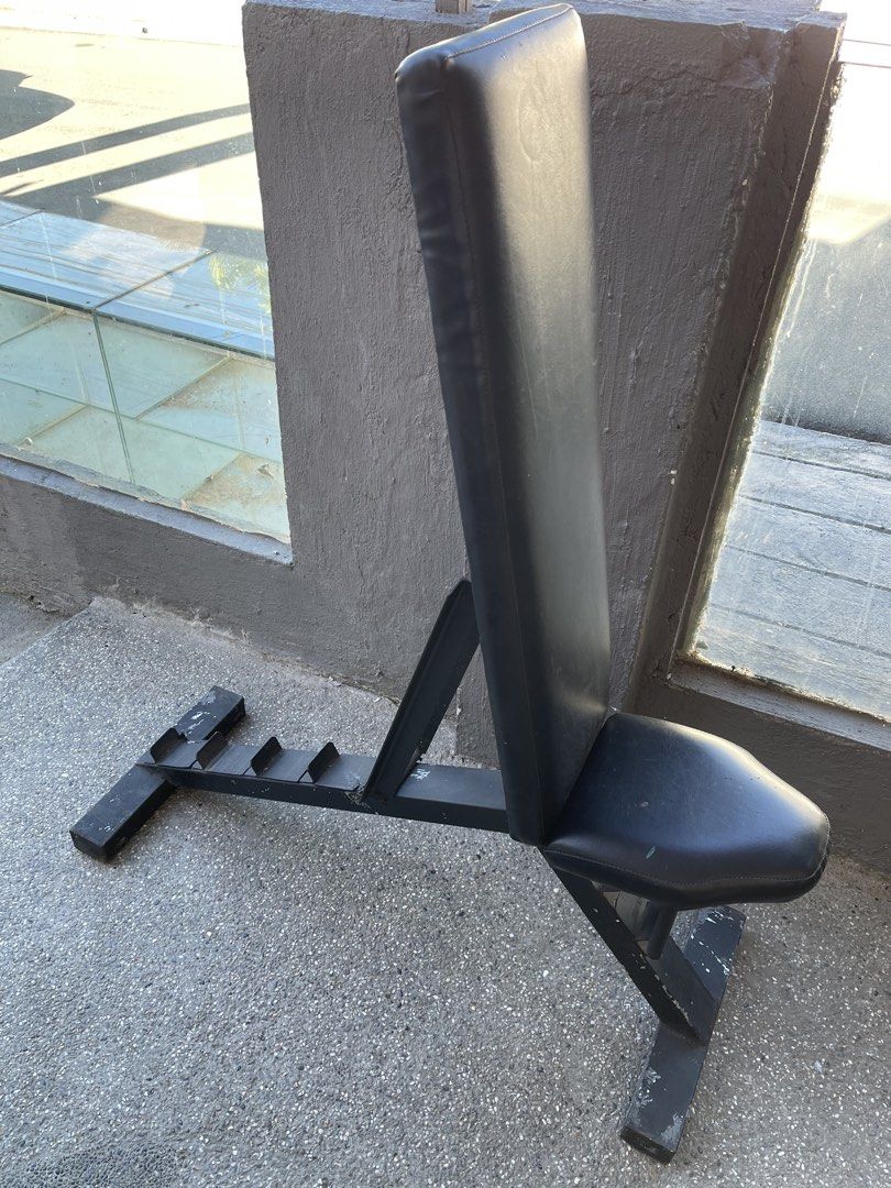 Adjustable Weight Bench Flat Incline Utility Workout Gym (Category: Weights & Dumbbells) located in Paranaque City. Submitted by cheskadejon (Listing ID 1471189502, Image 3). Description: - Adjustable weight bench ideal for home gym workouts - Sturdy black metal frame with comfortable, firm vinyl cushioning - Built-in multi-position incline support rack for versatile training - Great for bench presses, core work, and dumbbell routines - Condition