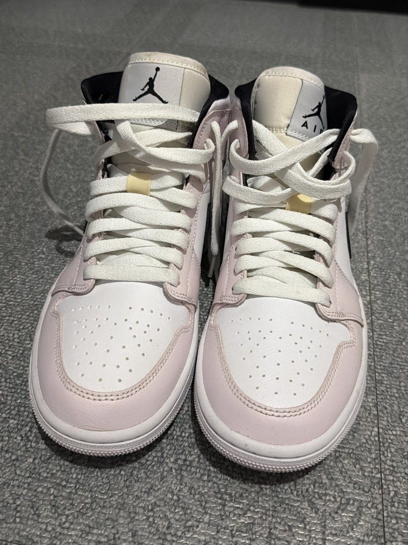 Air Jordan 1 Mid "Barely Rose" (Category: Sneakers) located in Cavite. Submitted by carlajeanner (Listing ID 1471212667, Image 1). Description: - Model: Air Jordan 1 Mid - Colorway: White leather base with light pink overlays and black swoosh - Branding: Jumpman logo on tongue, wings logo on collar - Size: US 7.5 / UK 5 / EUR 38.5 - Condition: Clean with minimal wear - Perfect for: Casual everyday fits - Grab them before someone else does!.