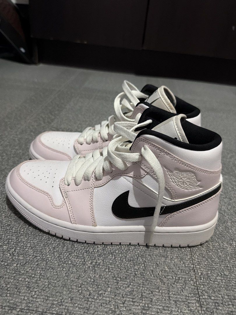 Air Jordan 1 Mid "Barely Rose" (Category: Sneakers) located in Cavite. Submitted by carlajeanner (Listing ID 1471212667, Image 2). Description: - Model: Air Jordan 1 Mid - Colorway: White leather base with light pink overlays and black swoosh - Branding: Jumpman logo on tongue, wings logo on collar - Size: US 7.5 / UK 5 / EUR 38.5 - Condition: Clean with minimal wear - Perfect for: Casual everyday fits - Grab them before someone else does!.