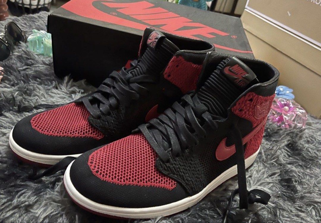 Air Jordan 1 Retro High Flyknit Bred (Category: Sneakers) located in Manila. Submitted by machooz (Listing ID 1471260827, Image 1). Description: - Model: Air Jordan 1 High Flyknit - Colorway: Bred (Black, Red, and White) - Details: Red knit upper, black overlays, leather swoosh, and original black laces - Inclusion: Original black Nike Air box - Size & Condition: Available upon request (send a message!) - Meetups and shipping options available.