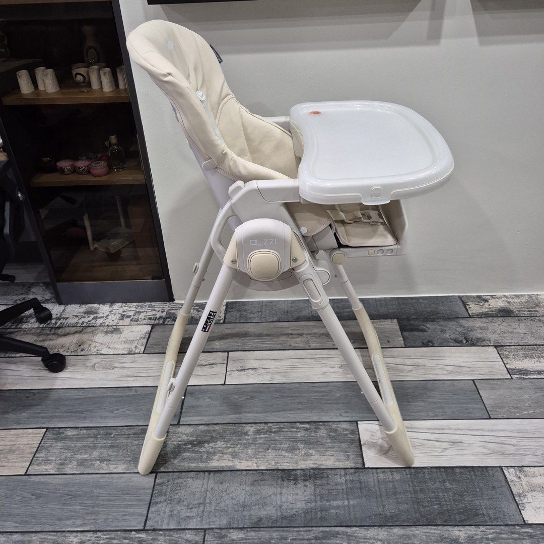 Akeeva Cozzi Baby High Chair Foldable Beige (Category: Baby High Chairs) located in Quezon City. Submitted by ilooverain (Listing ID 1471146477, Image 1). Description: ALL WORKING WELL JUST NEEDS CLEANING. Bought for P7200 selling for 3500 Akeeva Cozzi baby high chair in beige and white. Adjustable height and recline settings. Removable dining tray attaches to the back legs when folded. Padded seat cushion with safety harness straps. Compact fold