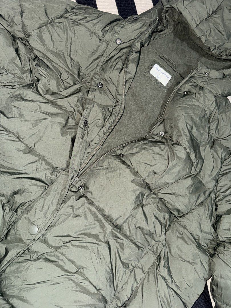 Amazon Essentials Olive Green Puffer Jacket Size 6X (Category: Coats, Jackets and Outerwear) located in Manila. Submitted by alendlr (Listing ID 1471200195, Image 2). Description: - Brand: Amazon Essentials - Size: 6XL - Color: Olive green - Lining: Soft fleece for extra warmth - Closure: Full zipper with snap buttons - Design: Puffy quilted design, ideal winter layer for kids.