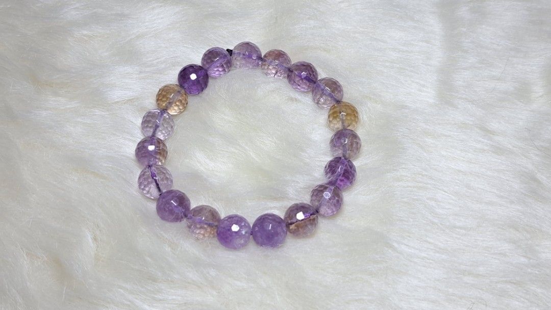 AMETRINE Gemstone BRACELET (Category: Bracelets) located in Quezon City. Submitted by crystallinehaven (Listing ID 1471140360, Image 2). Description: Genuine natural ametrine crystal bracelet ♦️1pc available ♦️p1850 neg - Beautiful alternating purple and golden-yellow hues - Sparkling faceted round beads that catch the light - Durable stretchy cord for easy slip-on wear - Great for stacking or wearing on its own - Size reference shown in photos n