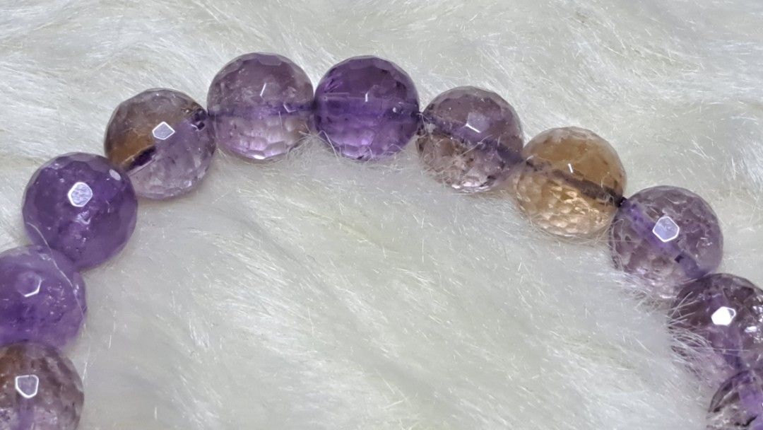 AMETRINE Gemstone BRACELET (Category: Bracelets) located in Quezon City. Submitted by crystallinehaven (Listing ID 1471140360, Image 3). Description: Genuine natural ametrine crystal bracelet ♦️1pc available ♦️p1850 neg - Beautiful alternating purple and golden-yellow hues - Sparkling faceted round beads that catch the light - Durable stretchy cord for easy slip-on wear - Great for stacking or wearing on its own - Size reference shown in photos n