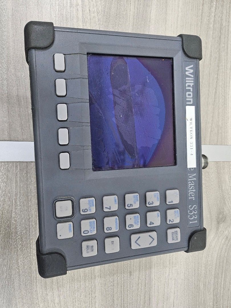 Anritsu S331L SiteMaster Cable and Antenna Analyzer (Category: Industrial Equipment) located in Pasig City. Submitted by ramleb123 (Listing ID 1471197887, Image 2). Description: - Model: Anritsu S331L SiteMaster Cable and Antenna Analyzer - Frequency Range: Up to 4 GHz - Build: Rugged grey and black housing with protective rubber bumpers and top handle strap - Condition: Shows normal dust and wear from field use - Identification: Calibration stic