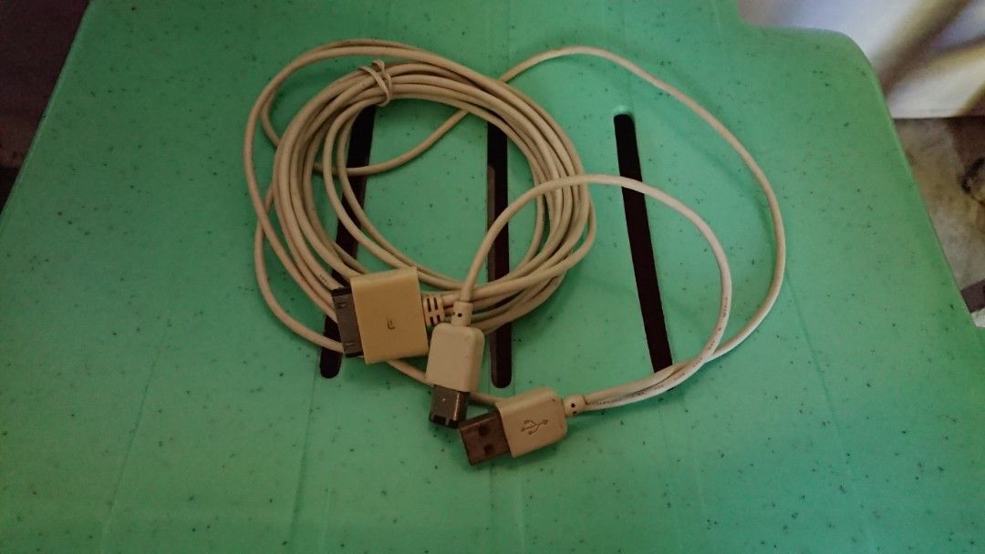 Apple Firewire Adapter and rare Y-Cable (Category: Chargers & Cables) located in Pozorrubio. Submitted by jazz1415 (Listing ID 1471271507, Image 2). Description: - Genuine Apple power brick with UK 3-pin plug - Y-cable fully supports USB charging and or Firewire charging - Fully tested and powers up ipods even without battery - Has light dirt and regular wear from previous use - Ideal charger for vintage Apple devices like ipods 1st gen, 2nd gen 
