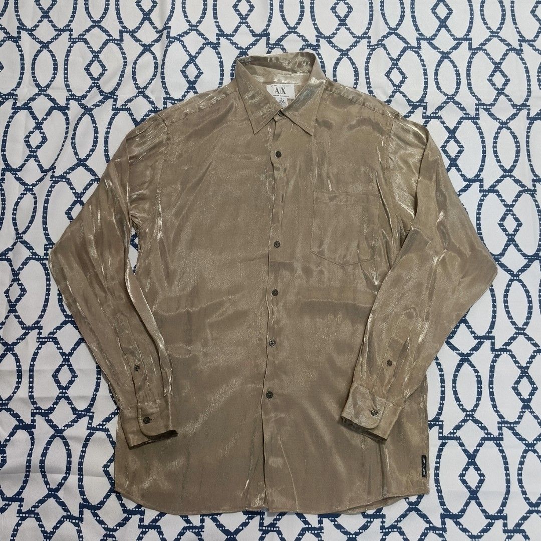 Armani Exchange lightbrown silk button up longsleeve (Category: Formal Shirts) located in General Trias. Submitted by tyoc_82706 (Listing ID 1471206558, Image 1). Description: Sleeves: 24 inches ‎Length: 30 inches ‎Width: 20 inches ‎Issue: missing 3rd button.