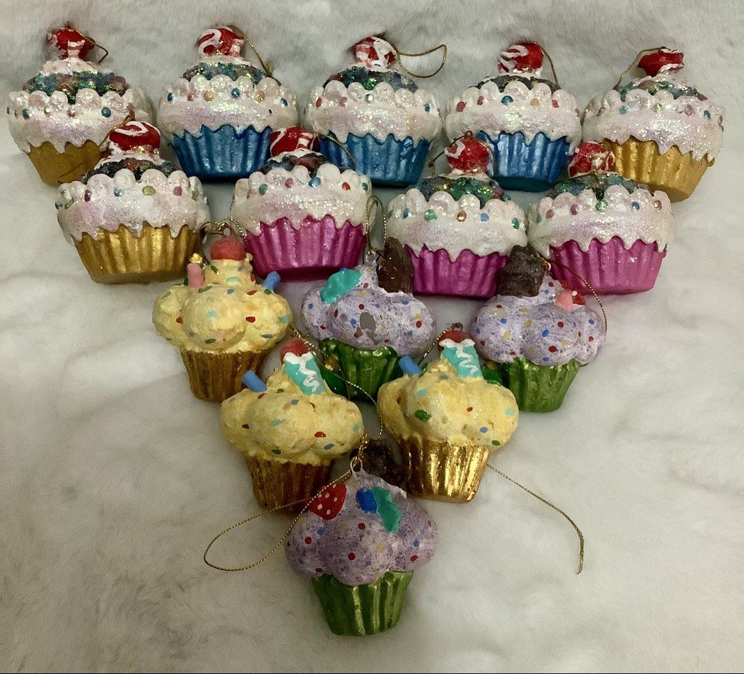 Assorted Cupcake Christmas Tree Ornaments Glitter Holiday Decor (Category: Other Home Decor) located in Quezon City. Submitted by heybailey (Listing ID 1471146242, Image 1). Description: - Handmade cupcake Christmas tree ornaments - Features lots of glitter, vibrant sprinkles, and realistic frosting details - Available in gold, pink, blue, yellow, and green cupcake liners - Topped with cute cherries or candies - Equipped with gold hanging strings