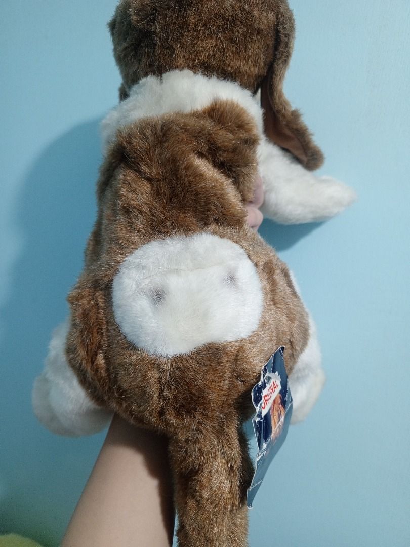 Aurora Classic Hush Puppy Stuffed Toy (Category: Plushies & Soft Toys) located in Palo. Submitted by fiercephoenix_23c798 (Listing ID 1471147834, Image 3). Description: - Brand/Model: Aurora Classic Hush Puppies Basset Hound Dog Plush Toy - Condition: Clean, fluffy fur with original tag attached - Design: Brown and white soft fur, floppy ears, and sweet embroidered eyes - Details: Soft stuffing throughout with a fluffy tail - Perfect for: Dog lov
