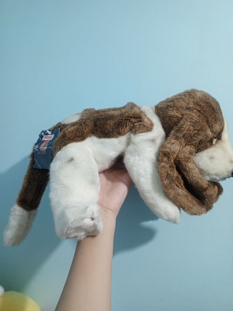 Aurora Classic Hush Puppy Stuffed Toy (Category: Plushies & Soft Toys) located in Palo. Submitted by fiercephoenix_23c798 (Listing ID 1471147834, Image 2). Description: - Brand/Model: Aurora Classic Hush Puppies Basset Hound Dog Plush Toy - Condition: Clean, fluffy fur with original tag attached - Design: Brown and white soft fur, floppy ears, and sweet embroidered eyes - Details: Soft stuffing throughout with a fluffy tail - Perfect for: Dog lov