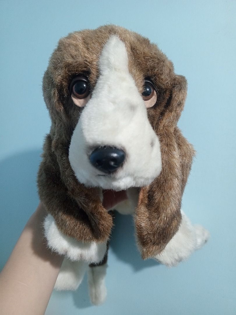 Aurora Classic Hush Puppy Stuffed Toy (Category: Plushies & Soft Toys) located in Palo. Submitted by fiercephoenix_23c798 (Listing ID 1471147834, Image 1). Description: - Brand/Model: Aurora Classic Hush Puppies Basset Hound Dog Plush Toy - Condition: Clean, fluffy fur with original tag attached - Design: Brown and white soft fur, floppy ears, and sweet embroidered eyes - Details: Soft stuffing throughout with a fluffy tail - Perfect for: Dog lov