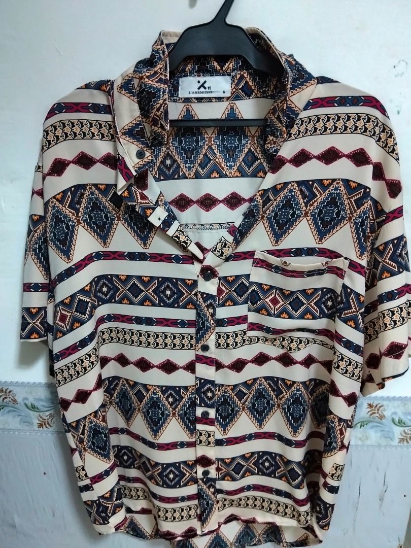 Aztec Print Short Sleeve Button Up Shirt Size M - oversized (Category: Tshirts & Polo Shirts ) located in Quezon City. Submitted by haaiv (Listing ID 1471144488, Image 1). Description: Already tailored. length - but not cropped. L - 27 - 27.5 W - 23 FIT IS OVERSIZED. - Size: Medium oversized - fits large to XL loose fit - Design: Bold Aztec diamond pattern in navy, maroon, and mustard on a cream base - Features: Front chest pocket, regular collar