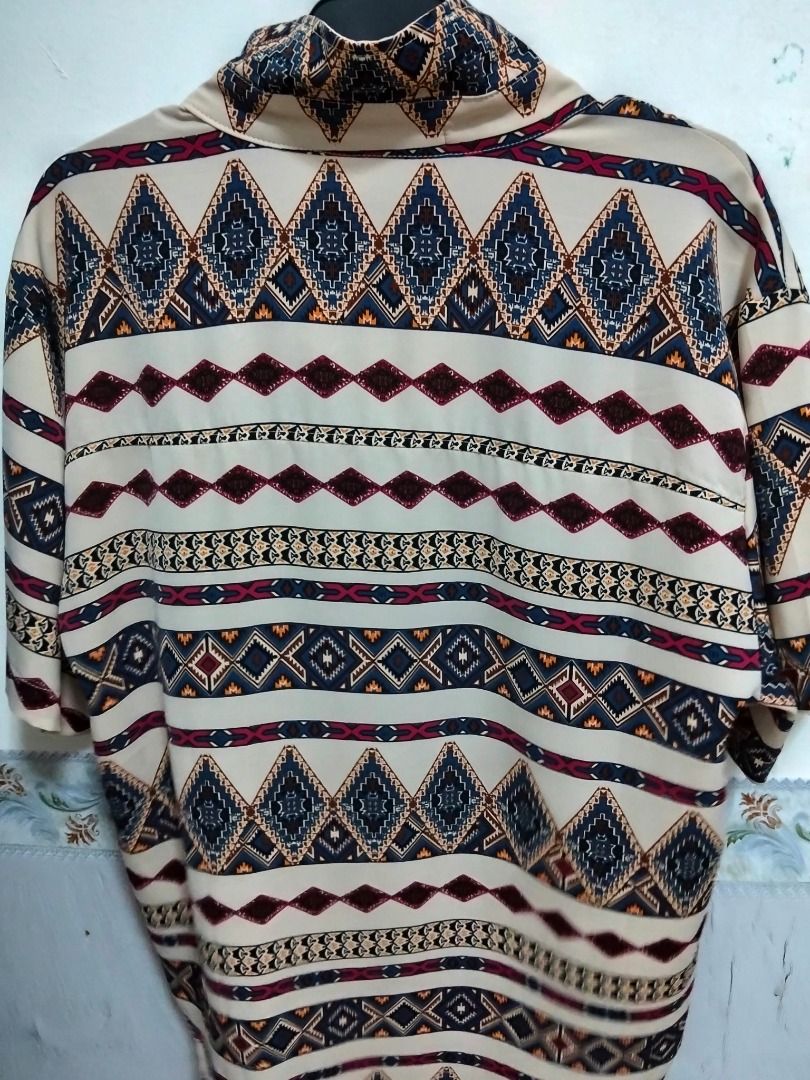 Aztec Print Short Sleeve Button Up Shirt Size M - oversized (Category: Tshirts & Polo Shirts ) located in Quezon City. Submitted by haaiv (Listing ID 1471144488, Image 3). Description: Already tailored. length - but not cropped. L - 27 - 27.5 W - 23 FIT IS OVERSIZED. - Size: Medium oversized - fits large to XL loose fit - Design: Bold Aztec diamond pattern in navy, maroon, and mustard on a cream base - Features: Front chest pocket, regular collar