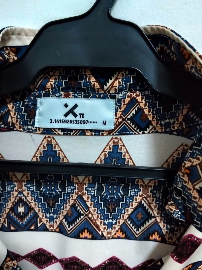 Aztec Print Short Sleeve Button Up Shirt Size M - oversized (Category: Tshirts & Polo Shirts ) located in Quezon City. Submitted by haaiv (Listing ID 1471144488, Image 2). Description: Already tailored. length - but not cropped. L - 27 - 27.5 W - 23 FIT IS OVERSIZED. - Size: Medium oversized - fits large to XL loose fit - Design: Bold Aztec diamond pattern in navy, maroon, and mustard on a cream base - Features: Front chest pocket, regular collar