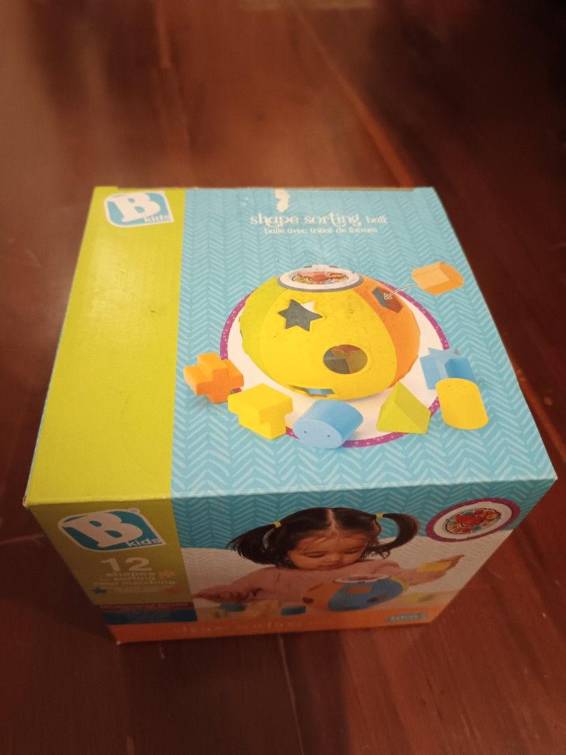 B. kids Shape Sorting Ball 12 Shapes 10m+ (Category: Educational & Learning Toys) located in Makati City. Submitted by ayekai (Listing ID 1471215500, Image 2). Description: - Brand: B. Kids Shape Sorting Ball - Recommended Age: 10 months and up - Features: 12 different shapes for sorting and color matching Bran - Benefits: Helps build hand-eye coordination and fine motor skills - Design: Colorful pieces with multi-textured surfaces - Condition: B