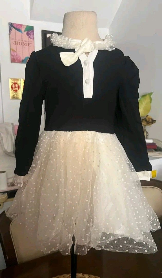 Baby dress (Category: Babies & Kids Fashion) located in Manila. Submitted by rubymielbona (Listing ID 1471222990, Image 1). Description: - Brand: Richie House (Model RH2076) - Color: Black and Beige - Size: 2-3 years - Material/Design: Black knit long-sleeve top with white button placket and cute bow collar - Skirt: Fluffy layered mesh skirt with white polka dots - Condition: Excellent, well-maintained ✨👑 Elegant Princess Dress 👑✨ 🌸 Brandnew �
