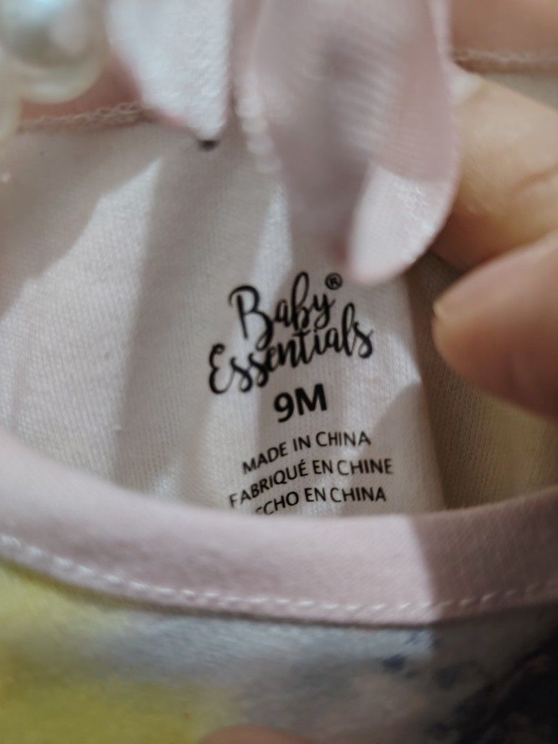 Baby Essentials Tie-Dye Onesie Romper 9M (Category: Babies & Kids Fashion) located in Makati City. Submitted by jayclutter0976004 (Listing ID 1471207143, Image 2). Description: - Brand: Baby Essentials - Size: 9M - Design: Vibrant multi-color tie-dye with blue, yellow, and purple watercolor splashes - Details: Charming pink trim along the neckline, cuffs, and bottom - Material: Soft, breathable cotton for all-day comfort - Convenience: Bottom sna