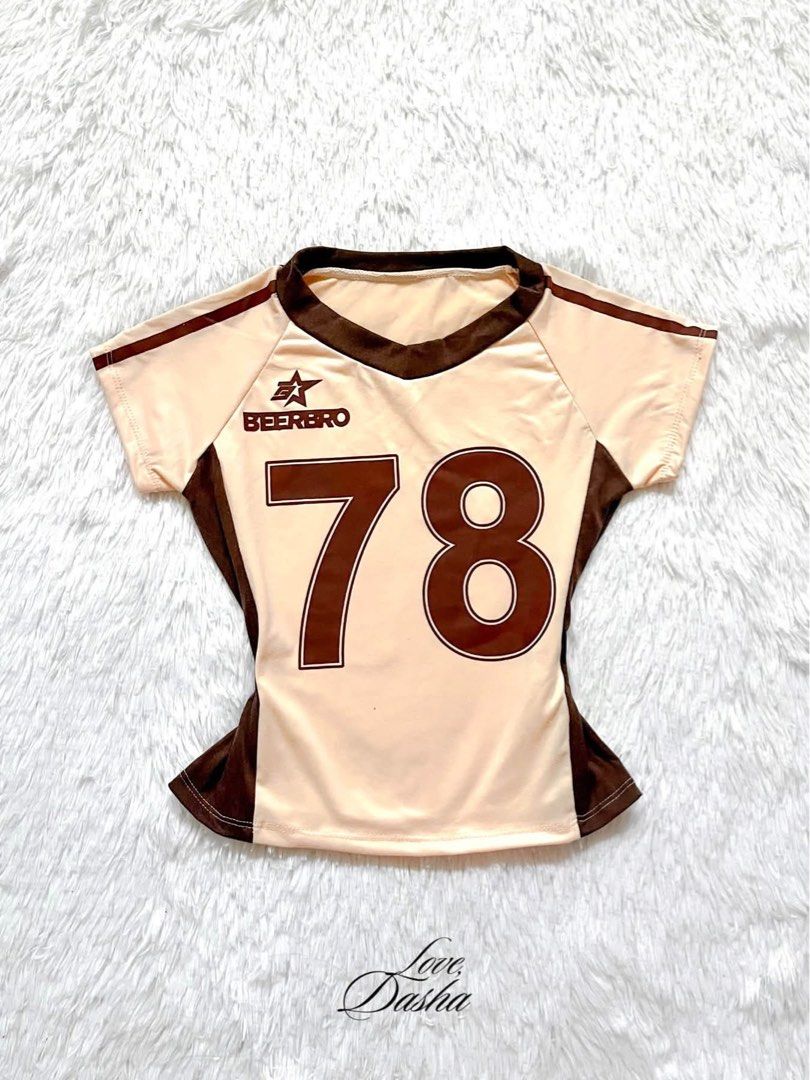 BEERBRO Jersey Style Crop Top Number 78 (Category: Shirts) located in Manila. Submitted by lovedasha.ph (Listing ID 1471194721, Image 1). Description: - Brand: BEERBRO - Color: Cream and brown with side panels - Style: Slim fit crop top, short sleeves, V-neck - Design: Large number 78 and brand logo print on the front - Material: Lightweight and stretchy jersey fabric.