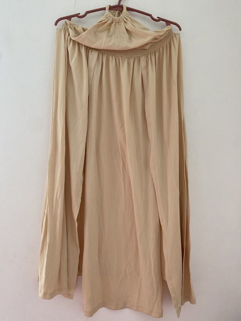 Beige halter neck maxi dress with open back (Category: Dresses) located in Bulacan. Submitted by prelovedbyjgs (Listing ID 1471200561, Image 1). Description: - Color: Beige - Style: Halter neck maxi dress with open back - Fit: Elastic waistband for comfortable sizing - Details: Adjustable tie closure, soft and flowy long skirt - Condition: Good, clean, and ready to wear - Perfect for: Casual outings, beach trips, or dates.