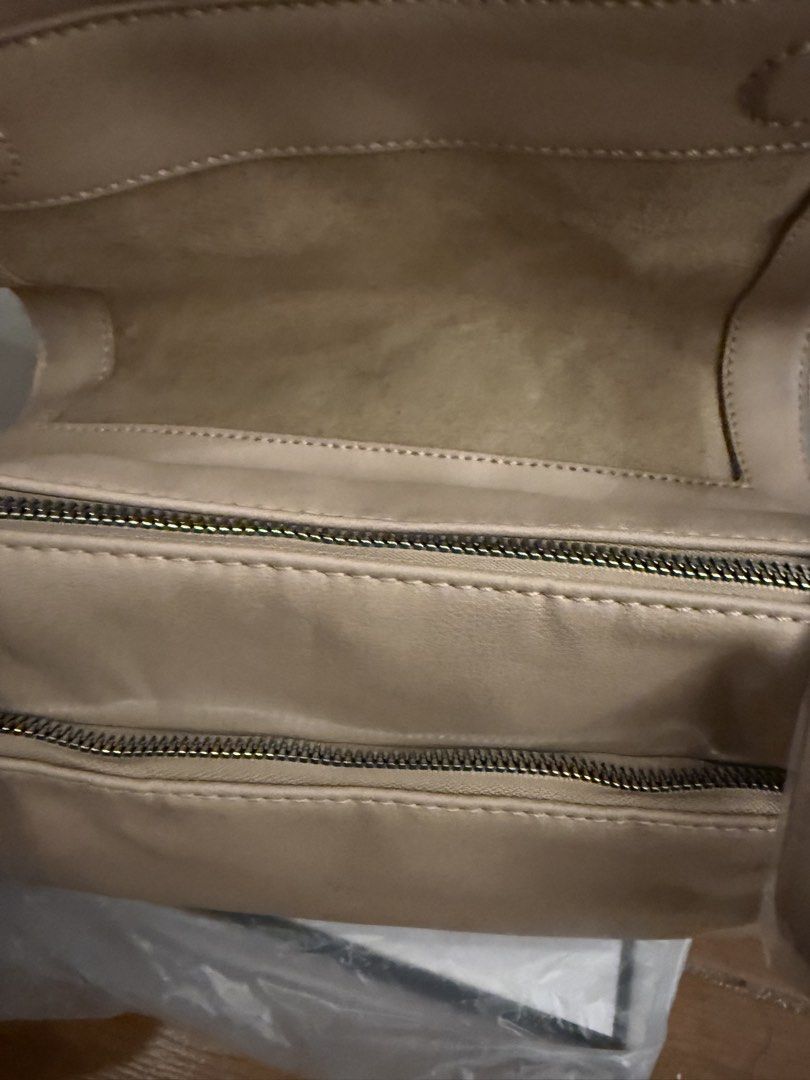 Beige Shoulder Bag Flap Closure (Category: Shoulder Bags) located in Bulacan. Submitted by emjay_17 (Listing ID 1471218356, Image 3). Description: - Color: Elegant beige - Style: Flap top shoulder bag - Material: Soft and smooth texture - Interior: Clean nude lining with zippered compartments - Size: Approx. 25cm (L) x 15cm (H) - Condition: Brand new, still wrapped in plastic protection.