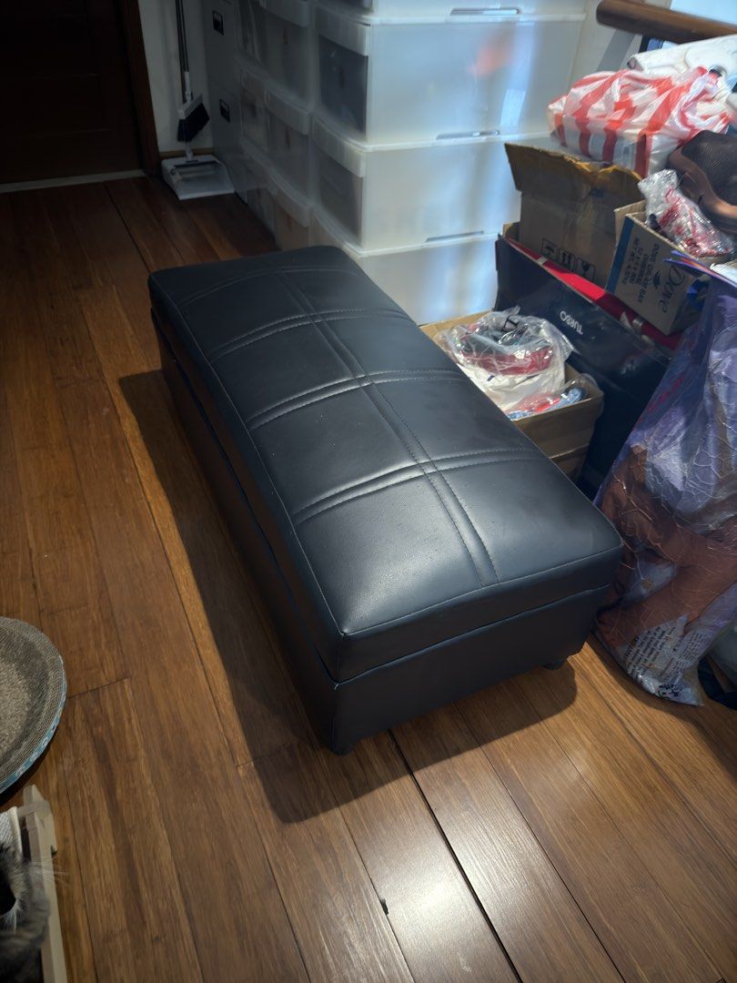 Black Faux Leather Storage Bench (Category: Chairs) located in Manila. Submitted by kelvs1435 (Listing ID 1471188795, Image 1). Description: - Color: Sleek black faux leather - Design: Elegant tufted top with stitched grid pattern - Functionality: Features a spacious hidden storage compartment inside - Dimensions: Approximately 49 inches long, 15 inches wide, and 16 inches high - Condition: Shows minor scratches and surface wear, priced according