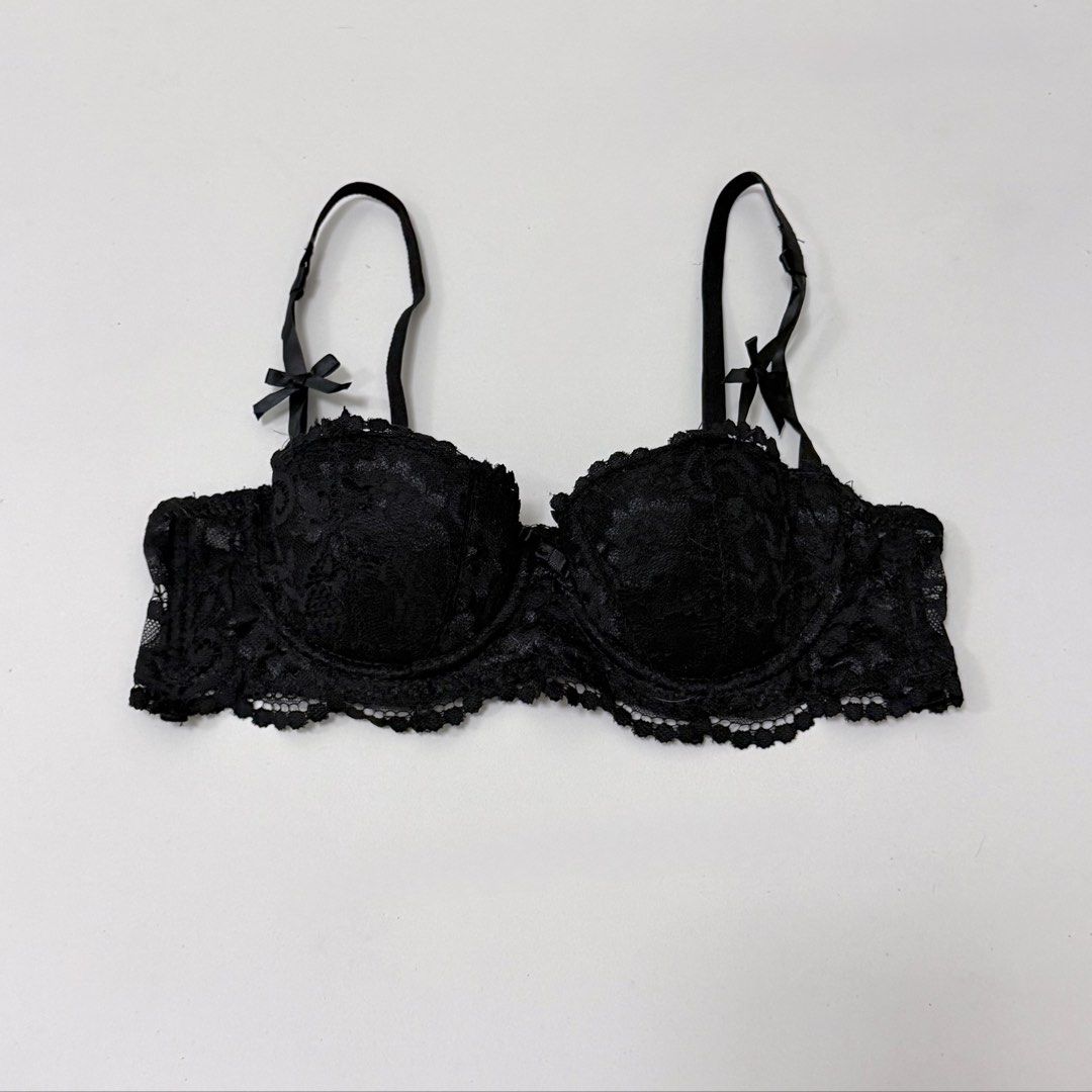 Black Floral Lace Half Cup Underwire Bra [34A] (Category: Undergarments & Loungewear) located in Malabon City. Submitted by k_intimates (Listing ID 1471286562, Image 2). Description: Details: • Size 34A / wired / lightly lined • Like new • Black floral lace half-cup underwire bra featuring scalloped edges and small decorative bows on the straps..