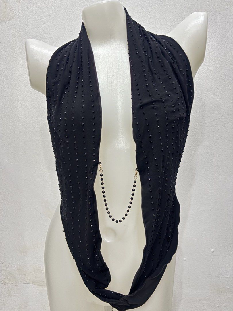 Black Halter Top with Beaded Details and Back Chain (Category: Sleeveless) located in Manila. Submitted by urechicthrftmnl (Listing ID 1471166943, Image 1). Description: - Color: Black - Style: Halter top with a deep plunging neckline - Details: All-over tiny bead studs on the front and an attached beaded chain that wraps around the back and lower waist with secure clasp closures - Material: Stretchy, comfortable mesh-like fabric - Occasion: Idea