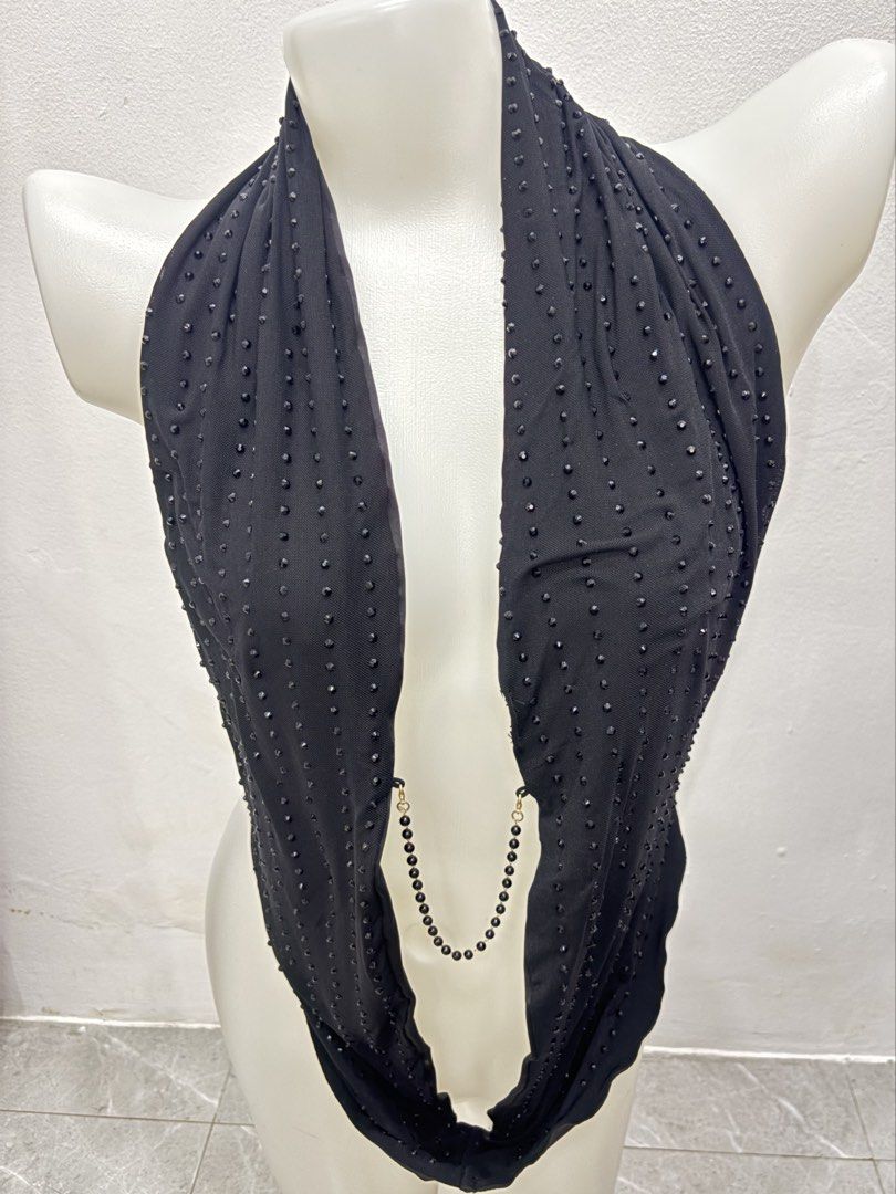 Black Halter Top with Beaded Details and Back Chain (Category: Sleeveless) located in Manila. Submitted by urechicthrftmnl (Listing ID 1471166943, Image 2). Description: - Color: Black - Style: Halter top with a deep plunging neckline - Details: All-over tiny bead studs on the front and an attached beaded chain that wraps around the back and lower waist with secure clasp closures - Material: Stretchy, comfortable mesh-like fabric - Occasion: Idea