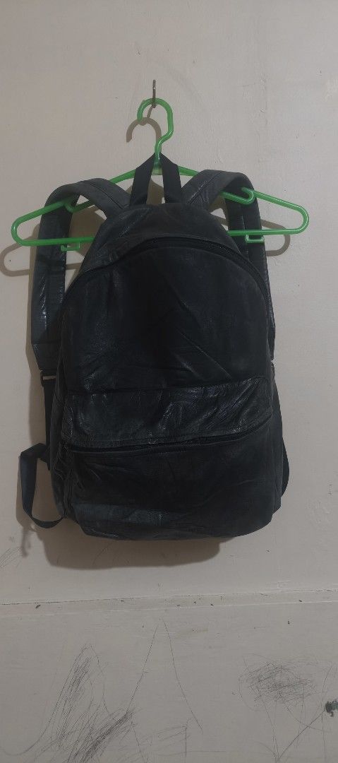 Black leather backpack Japan porter (Category: Backpacks) located in Caloocan City. Submitted by abykilo99-61094 (Listing ID 1471285762, Image 1). Description: - Material: Soft tumbled leather with natural creases and wear lines for a stylish lived-in look nego - Compartments: Secure main zip compartment opening at the top plus a neg convenient front zipper pocket - Comfort: Adjustable shoulder straps featuring padded mesh backing for all-day car
