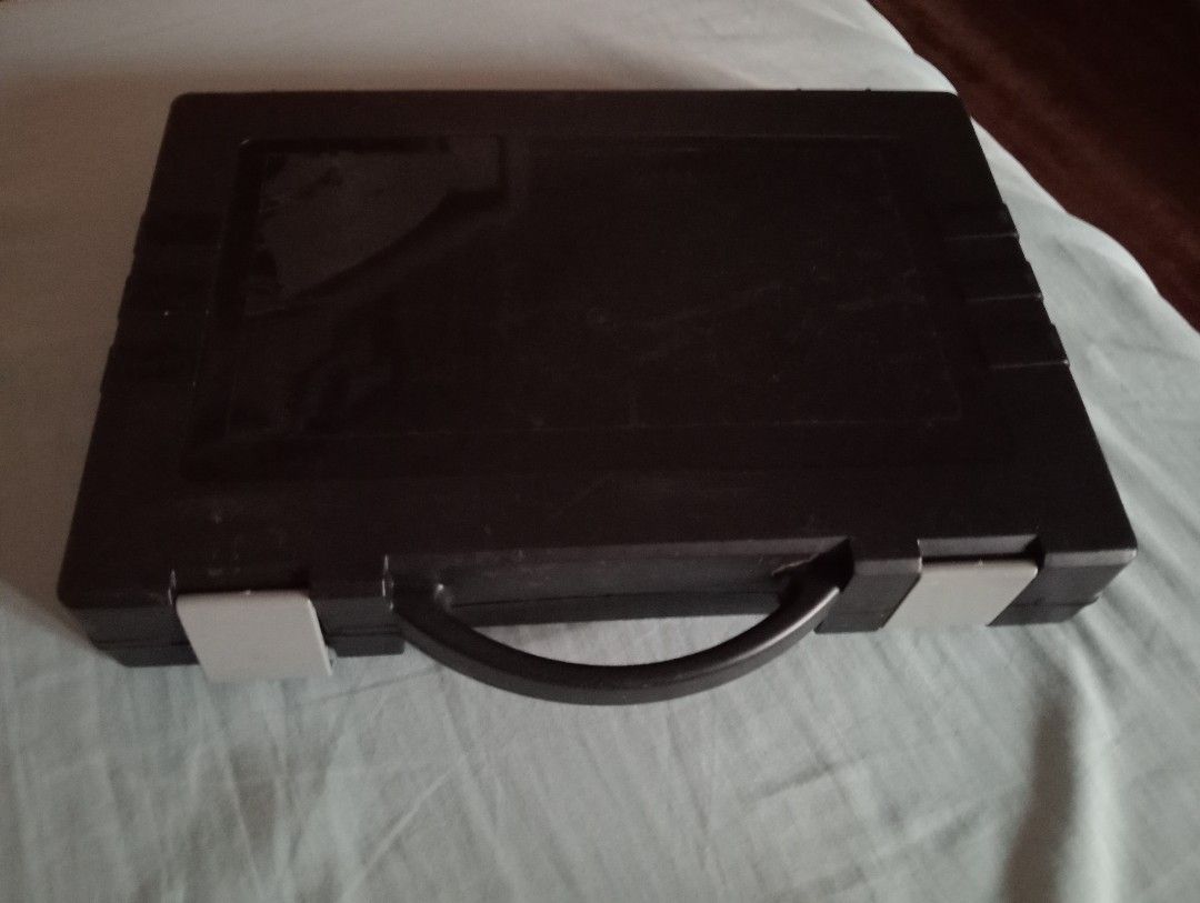 Black plastic storage case with handle and latches (Category: Storage Boxes & Baskets) located in Makati City. Submitted by YSL80022 (Listing ID 1471145283, Image 2). Description: - Durable black plastic utility case - Sturdy top carrying handle - Secure dual grey plastic locking clips - Spacious empty interior for tools, small items, or documents - Lightweight and portable - Condition: Minor scuffs from normal handling - Size: can fit long bond 