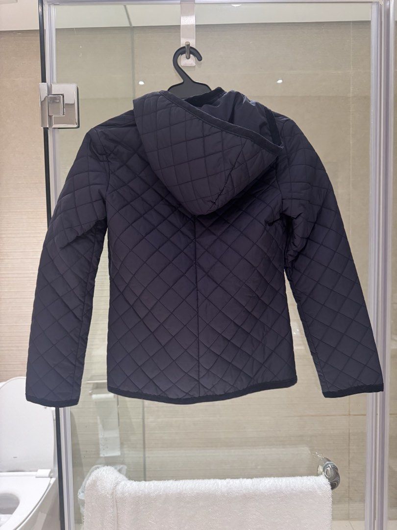 Black Quilted Hooded Winter Jacket (Category: Coats, Jackets and Outerwear) located in Quezon City. Submitted by tinylee60 (Listing ID 1471164062, Image 1). Description: - Color: navy blue - Style: Quilted jacket with matching hood and diamond pattern stitching - Details: Long sleeves with dark trim on cuffs and hem - Material: Lightweight, perfect for layering in cooler weather - Condition: very good almost new.