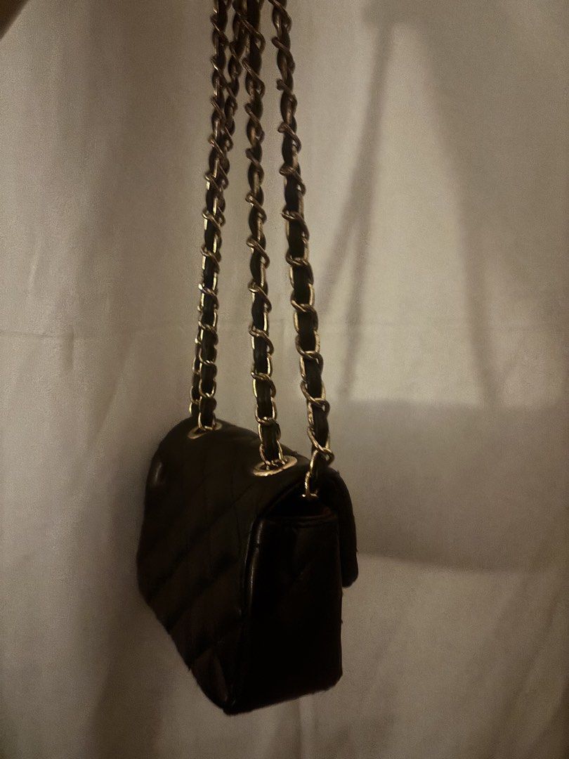 Black Quilted Leather Chain Shoulder Bag chanel (Category: Shoulder Bags) located in Las Pinas. Submitted by bellagvr (Listing ID 1471142991, Image 3). Description: - Color & Material: Black quilted leather - Hardware: Gold-tone - Strap: Chain interlaced with black leather - Closure: Classic flap with interlocking CC turn-lock - Size: Compact and structured, ideal for daily essentials - Style: Versatile design that matches any outfit.