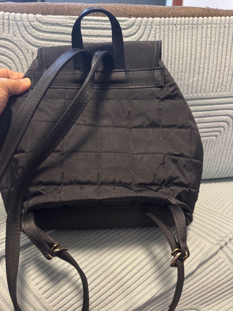 Black Quilted Nylon Mini Backpack with Gold Hardware (Category: Backpacks) located in Imus. Submitted by budolfindsimus (Listing ID 1471257361, Image 3). Description: 🖤 Japan Source Quilted Backpack - Minimalist Black! Japan source thrift find 🇯🇵✨ Details: 🖤 Color: Jet black - super classy 🧵 Material: Quilted nylon - light & durable ✨ Gold hardware zipper - sosyal! 🎒 Style: Backpack + may top handle 📐 Size: Medium - kasya daily essentials,