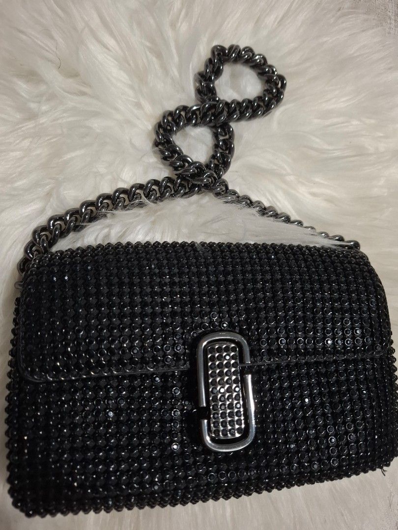 Black rhinestone chain strap crossbody evening bag (Category: Luxury Bags & Wallets) located in Dasmarinas. Submitted by safehawk.7efe62 (Listing ID 1471258212, Image 1). Description: - Style: Evening wear / Party handbag - Color/Design: Fully covered in sparkly black rhinestones - Hardware: Matching black rhinestone clasp with dark metal accents - Strap: Removable chunky dark metal chain - Closure: Secure flap closure - Size: Compact and handy f