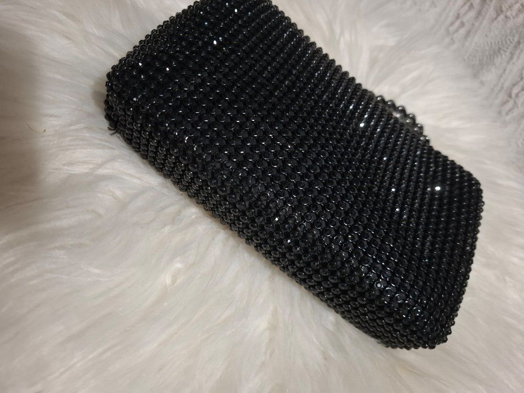 Black rhinestone chain strap crossbody evening bag (Category: Luxury Bags & Wallets) located in Dasmarinas. Submitted by safehawk.7efe62 (Listing ID 1471258212, Image 3). Description: - Style: Evening wear / Party handbag - Color/Design: Fully covered in sparkly black rhinestones - Hardware: Matching black rhinestone clasp with dark metal accents - Strap: Removable chunky dark metal chain - Closure: Secure flap closure - Size: Compact and handy f