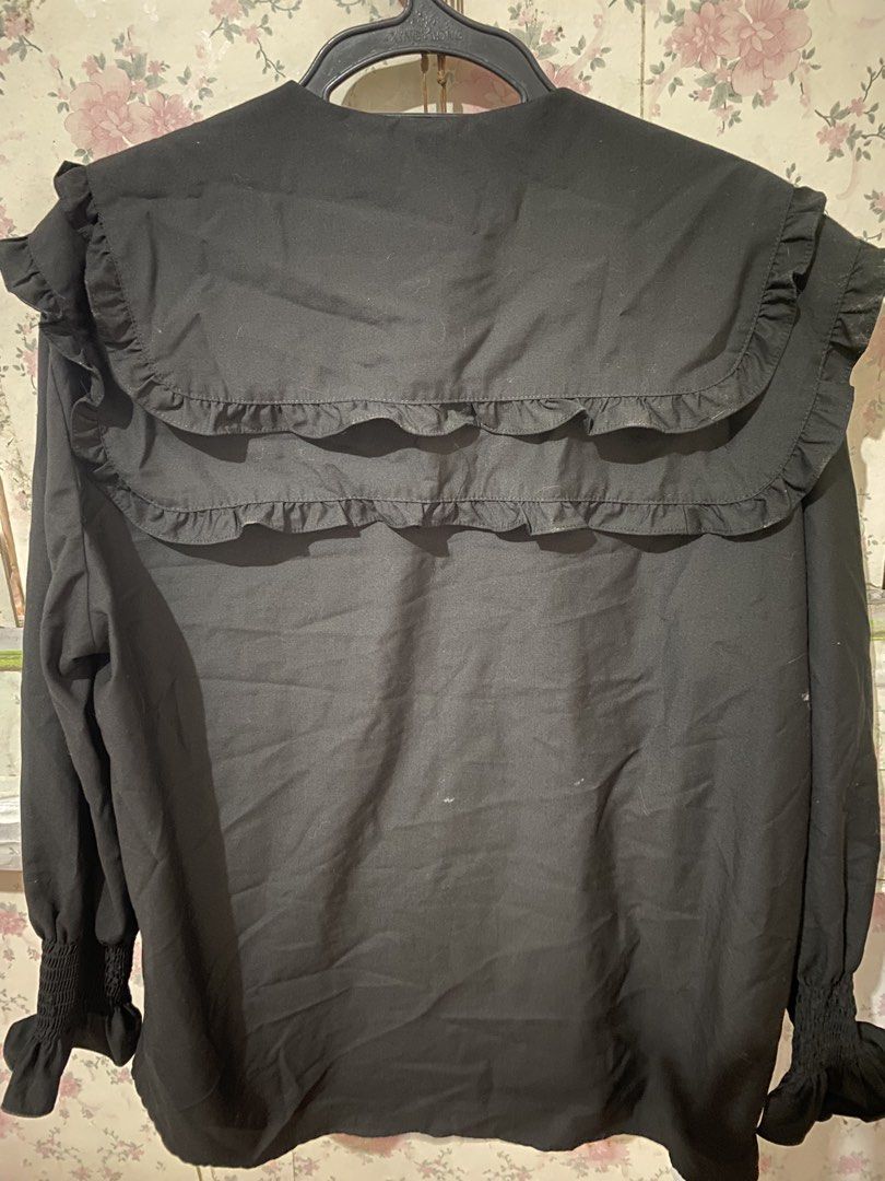 Black Ruffle Collar Long Sleeve Blouse (Category: Blouses) located in Makati City. Submitted by oncejjang (Listing ID 1471124489, Image 2). Description: - Color: Black - Design: Double-layered ruffled collars (front and back), smocked cuffs with ruffled ends, button-down front closure - Mode of Payment: GCash, Maribank etc - Shipping: Fast shipping via J&T Express (Metro Manila & Provincial) or same day delivery 📦 - meet up for makati area or mr