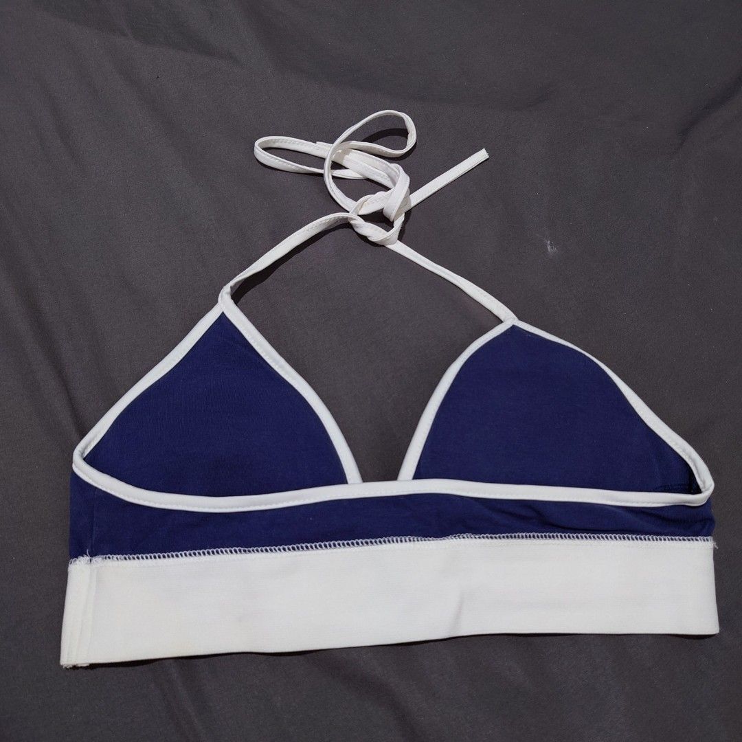 Blue and White Halter Top with BCAC Print (Category: Sleeveless) located in Diffun. Submitted by declutteredbyJill (Listing ID 1471233890, Image 2). Description: - Navy blue and white halter top with adjustable neck ties - Thick elastic underbust band featuring bold 'BCAC' lettering - Detailed white collegiate crest emblem with '1991' on the right cup - Stylish white trim framing the triangle cups - Made from a comfortable, soft cotton-blend fabr