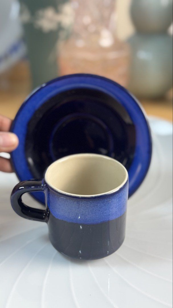 Blue Ceramic Espresso Cups And Saucers Stackable Set (Category: Coffee & Tea Tableware) located in Masinloc. Submitted by kristineba02273 (Listing ID 1471150538, Image 3). Description: - Set of 3 ceramic espresso cups with matching saucers - Beautiful deep blue glaze with a lighter blue gradient band and cream interior - Stackable design helps save precious cabinet space - Glossy and smooth finish, perfect for morning shots or after-dinner espres