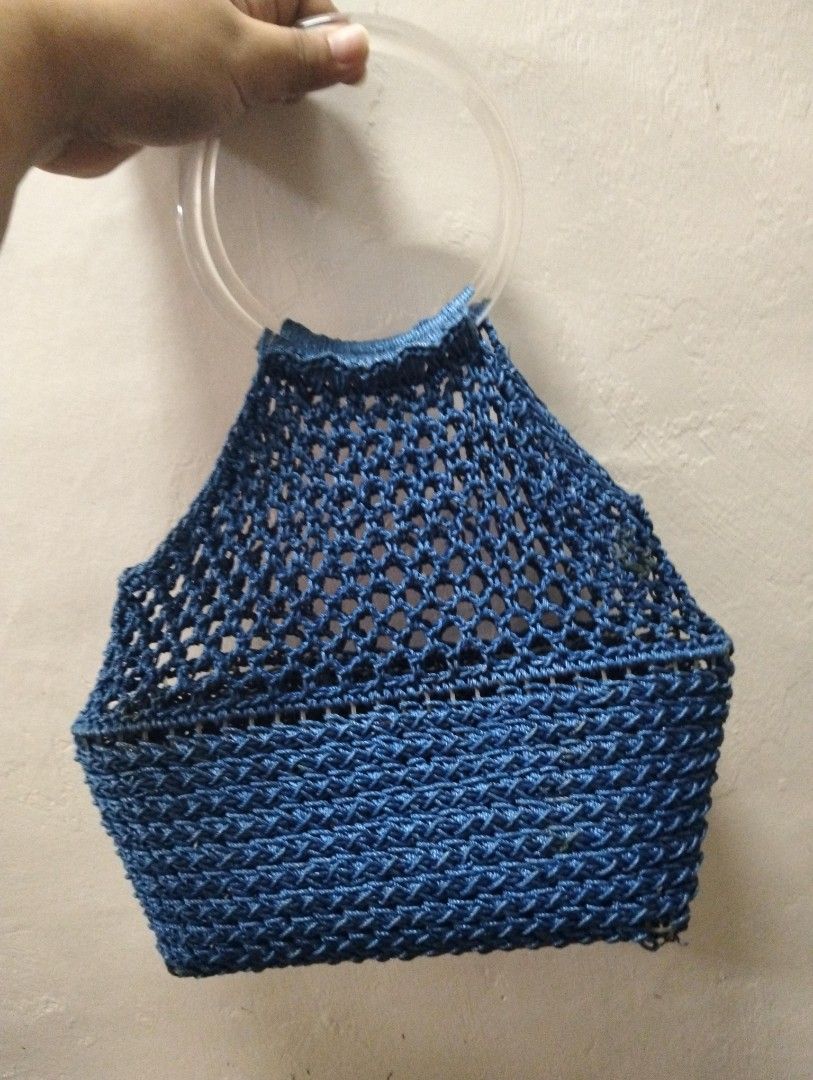 Blue Crochet Net Handbag with Clear Ring Handles (Category: Shoulder Bags) located in Gasan. Submitted by AngeliqueKaye (Listing ID 1471210494, Image 1). Description: - Color: Deep blue - Material: Durable crochet cord with neat stitching - Handles: Modern clear circular plastic handles - Structure: Sturdy woven base with a trendy see-through net top - Size: Compact and lightweight, ideal for daily essentials and casual days out.