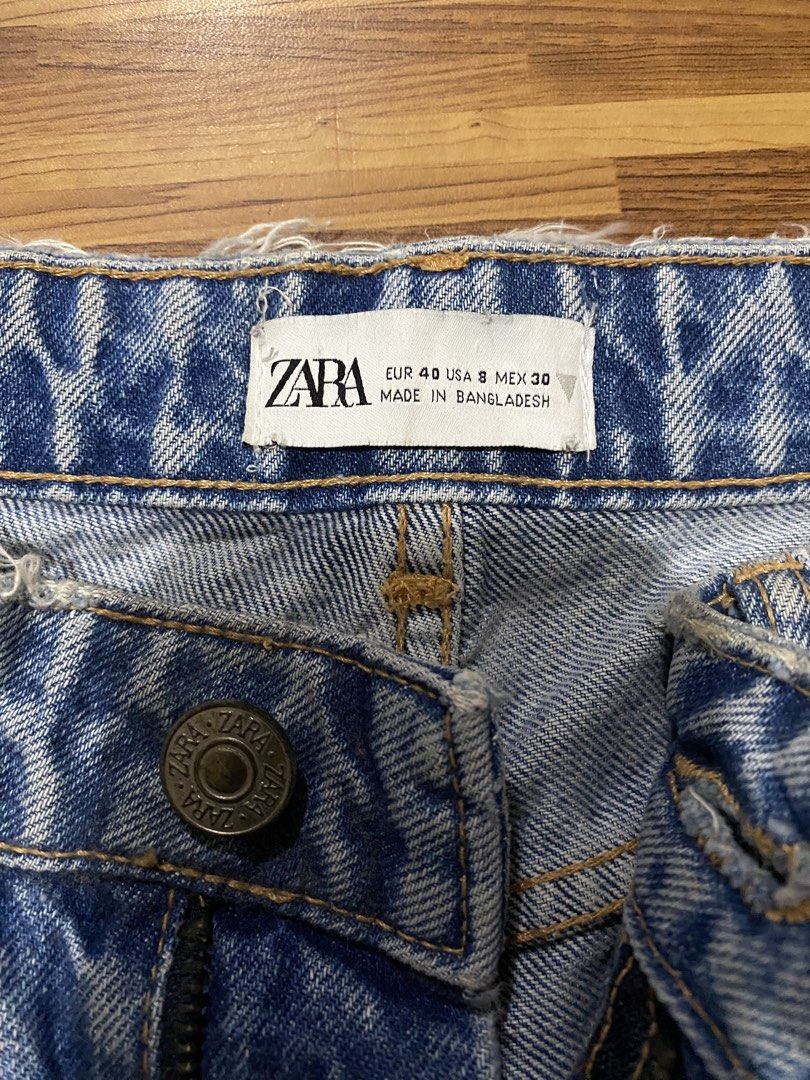 Blue Denim Jeans (Category: Jeans) located in Manila. Submitted by ellieeeeee0293929 (Listing ID 1471123143, Image 2). Description: - Brand: Zara - Color: Medium wash blue - Size: EUR 40 / USA 8 / MEX 30 - Design: Classic five-pocket style with button closure and zip fly - Detail: Trendy raw hem on waistband and cuffs for a relaxed vibe - Condition: Excellent - Origin: Made in Bangladesh.