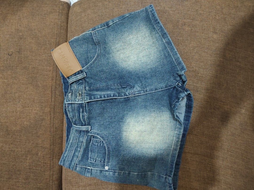 Blue Denim Shorts with Light Wash (Category: Shorts) located in Quezon City. Submitted by xanniehua (Listing ID 1471230198, Image 1). Description: - Style: Mid-rise blue denim shorts - Wash: Light wash fade on the front with a tan 'JEANS' leather patch - Closure: Front button and zip - Pockets: Standard front and back pockets - Fit: Comfortable basic piece, easy to pair with tees and tank tops.